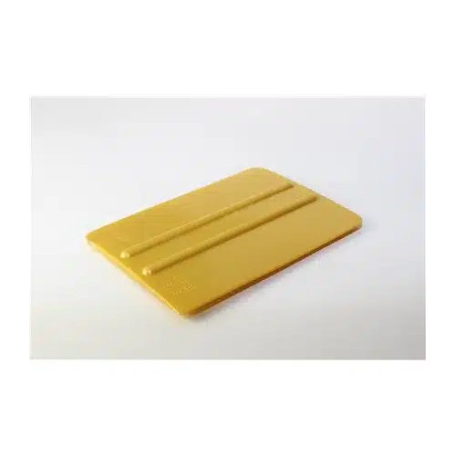 Espátula dorada para aplicación de vinilo